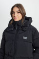 Loose Fit Rahat Kesim Kapüşonlu Fermuarlı Kadın Uzun Siyah Şişme Mont Loose Fit Rahat Kesim Kapüşonlu Fermuarlı Kadın Uzun Siyah Şişme Mont